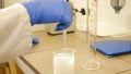 Laboratory scientific reseach. Liquid density measurement. Chemical reaction. Testing samples. Scientist Examining