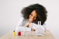 Laboratory scientist, chemist or pharmacist at work in a laboratory. Portrait of a young beautiful African American girl Royalty Free Stock Photo