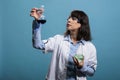 Laboratory scientist expert analyzing volumetric glass flask filled with liquid substance sample Royalty Free Stock Photo