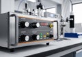 A laboratory setting featuring a control panel device with a metal casing, displaying knobs labeled Royalty Free Stock Photo
