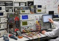 A laboratory setting with multiple electronic test instruments, including oscilloscopes, multimeters Royalty Free Stock Photo