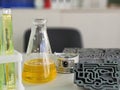 Laboratory setup with colored liquids and mechanical parts on a workbench in a scientific Royalty Free Stock Photo