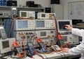 Laboratory setup featuring multiple electronic testing instruments, including oscilloscopes and Royalty Free Stock Photo