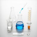 Laboratory setup featuring various glassware on a white background Royalty Free Stock Photo