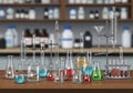 A laboratory setup featuring various glassware on a wooden Royalty Free Stock Photo