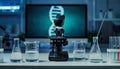 Laboratory setup with microscope and DNA display for scientific research Royalty Free Stock Photo