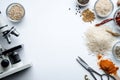 Scientific Research on Grains and Spices - Microscope and Ingredients Royalty Free Stock Photo