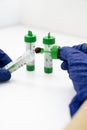 Laboratory technician collecting stool sample for medical analysis Royalty Free Stock Photo