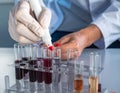 Laboratory Technician Conducting Blood Test with Test Tubes Royalty Free Stock Photo