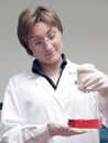 Laboratory technician with flask