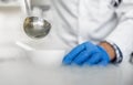 Laboratory technician performs an experiment with liquid nitrogen