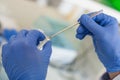 Laboratory technician take a sample with chemistry spoon