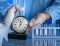 Laboratory Technician Using Stopwatch for Scientific Experiment Royalty Free Stock Photo