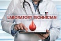 Laboratory technician working with tablet in hands in the lab wi