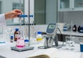 Laboratory titration experiment with ph meter and pink solution in conical flask Royalty Free Stock Photo