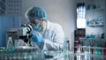 Laboratory worker carefully exploring samples to detect chronic pathologies Royalty Free Stock Photo