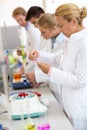 Laboratory worker checking test tube Royalty Free Stock Photo