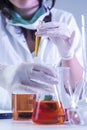 Laboratory Worker Dealing With Flasks Containing Liquid Chemicals Royalty Free Stock Photo