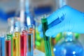 Laboratory worker holding test tube with liquid, closeup Royalty Free Stock Photo