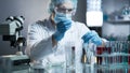 Laboratory worker measuring exact formula for hypoallergenic cosmetic products