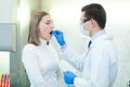 Laboratory worker performing DNA paternity test in a medical laboratory. Implementation of DNA sampling in humans