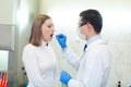 Laboratory worker performing DNA paternity test in a medical laboratory. Implementation of DNA sampling in humans