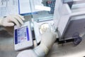 Laboratory worker in sterile rubber gloves, weighs the manufactured tablets on the control scales. Royalty Free Stock Photo