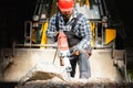 A laborer uses a jackhammer to break up a concrete pavement Royalty Free Stock Photo