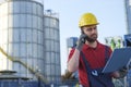 Laborer outside a factory working dressed with safety overalls Royalty Free Stock Photo