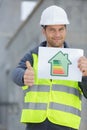 laborer showing energy rating sign Royalty Free Stock Photo