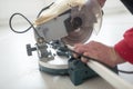 Laborer using a small electric circular saw