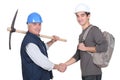 Laborer welcoming young apprentice Royalty Free Stock Photo