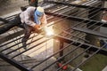 Laborers are making steel roofs painted black Royalty Free Stock Photo