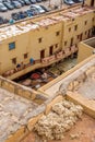 Laborers working in Chouwara tannery. Fez El Bali Medina. Morocco. Royalty Free Stock Photo