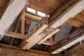 laborious work an old house is restored, whereby old beams are strengthened with new ones Royalty Free Stock Photo