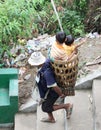 People carry children down the hill.