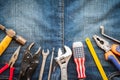 Labour Day, May 1. Many handy tools with blank space on jeans Royalty Free Stock Photo