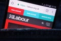 The Labour Party website displayed on smartphone hidden in jeans pocket