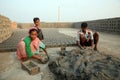 Labourers prepare bricks at a brick kiln in Sarberia, West Bengal, India Royalty Free Stock Photo