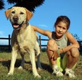 Labrador Retriever with lilttle girl in the park Royalty Free Stock Photo