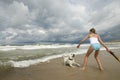 Labrador retriever playing on the beach.