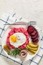 Labskaus, mashed potatoes with the beet, fried egg Royalty Free Stock Photo