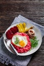 Labskaus, mashed potatoes with the beet, fried egg