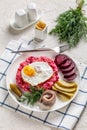 Labskaus, mashed potatoes with the beet, fried egg Royalty Free Stock Photo