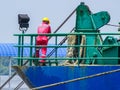 Labuan,Malaysia-July 29,2019:Sea crew ship controlling the hydraulic ship winch mechanism with hawser on ship deck in Labuan,Malay