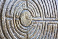 Labyrinth carved on the stone facade of a Romanesque church of the 11th century