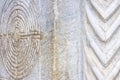 Labyrinth carved on the stone facade of a Romanesque church of the 11th century Tuscany - Italy Royalty Free Stock Photo