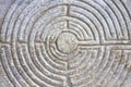 Labyrinth carved on the stone facade of a Romanesque church of the 11th century Tuscany - Italy Royalty Free Stock Photo