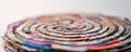 A labyrinth made from layered newspaper clippings symbolizing the complex and often confusing world of modern media