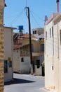 Labyrinthine streets in Zarros with electricity pole Royalty Free Stock Photo